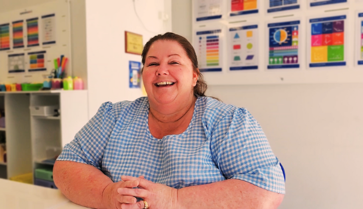 Nikki from Kip McGrath Torquay sitting at a desk, providing personalised tutoring for students.