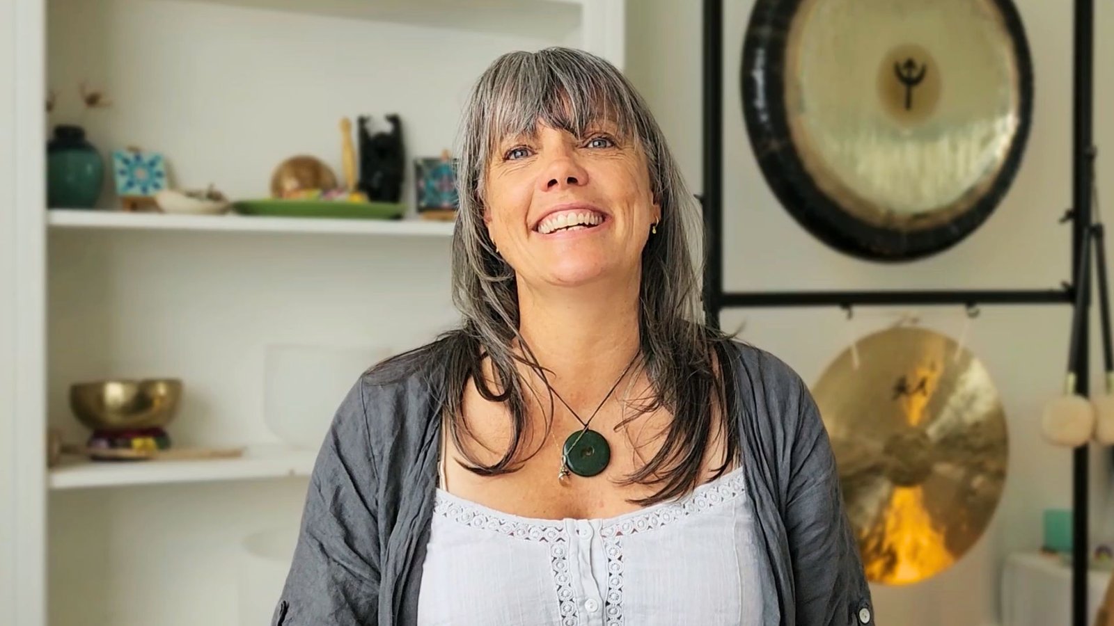 Portrait of Stephanie smiling warmly in Lisa's Torquay studio, sharing her family's customer success story about finding a sanctuary through music.